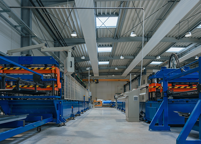 Automated production and assembly line with industrial machinery for efficient manufacturing and material handling.